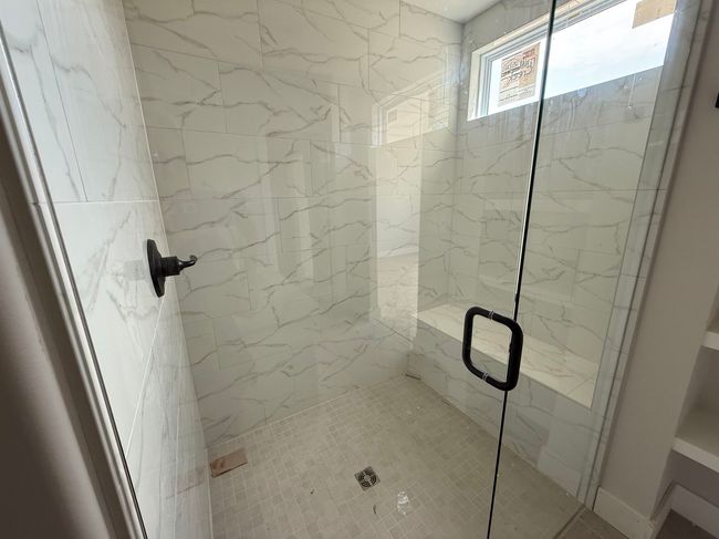 Full bath with a marble finish shower | Image 10