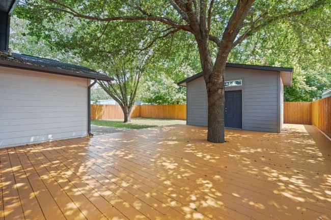 Wooden terrace featuring a fenced backyard | Image 23