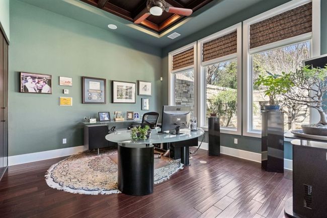 Downstairs office with laundry/hobby room at rear. | Image 23