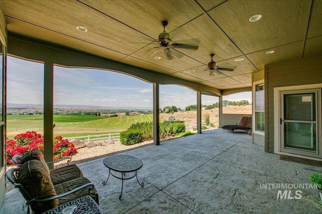 View of patio with ceiling fan | Image 37