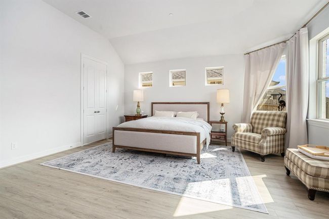 The spacious master suite has spectacular views of nature and the water life | Image 13