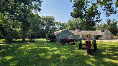 Long driveway greets you and your guests as you ap | Image 1