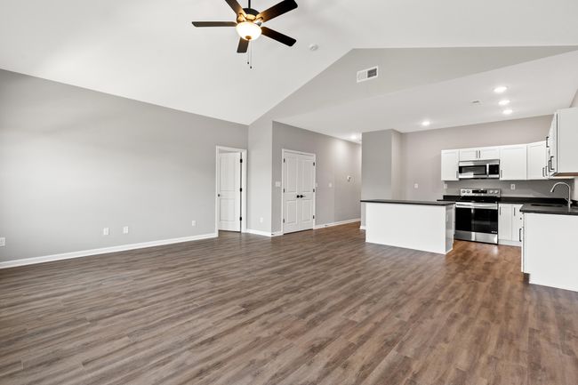 View of living room/kitchen from back of home | Image 12