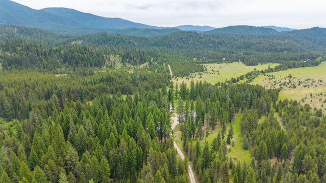 Mountain view with a heavily wooded area | Image 6