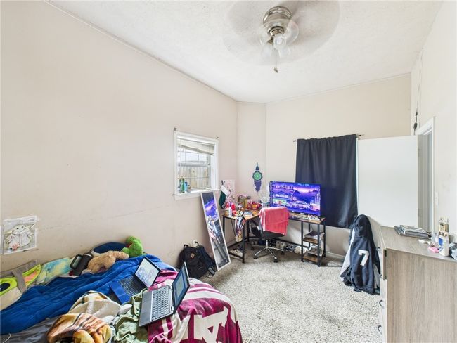 Bedroom featuring carpet flooring and ceiling fan | Image 11