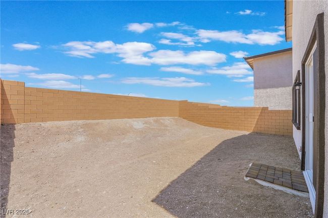 View of fenced backyard | Image 34