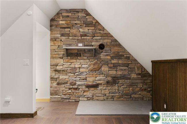 An in-law Suite? A Den? A Playroom? So many options and fireplace ready! | Image 44