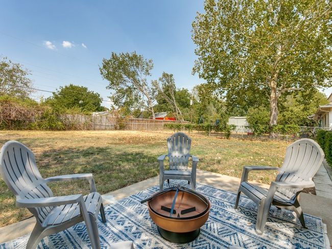View of patio / terrace featuring a fire pit and a fenced backyard | Image 10
