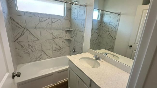 Full bathroom featuring bathing tub / shower combination and vanity | Image 20