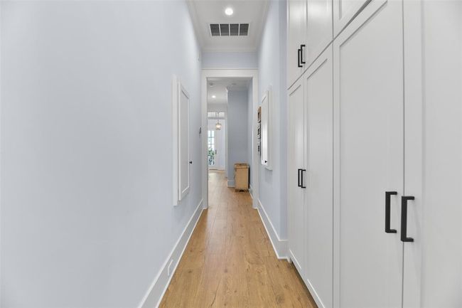 Lower-level hallway offers ample storage. | Image 31