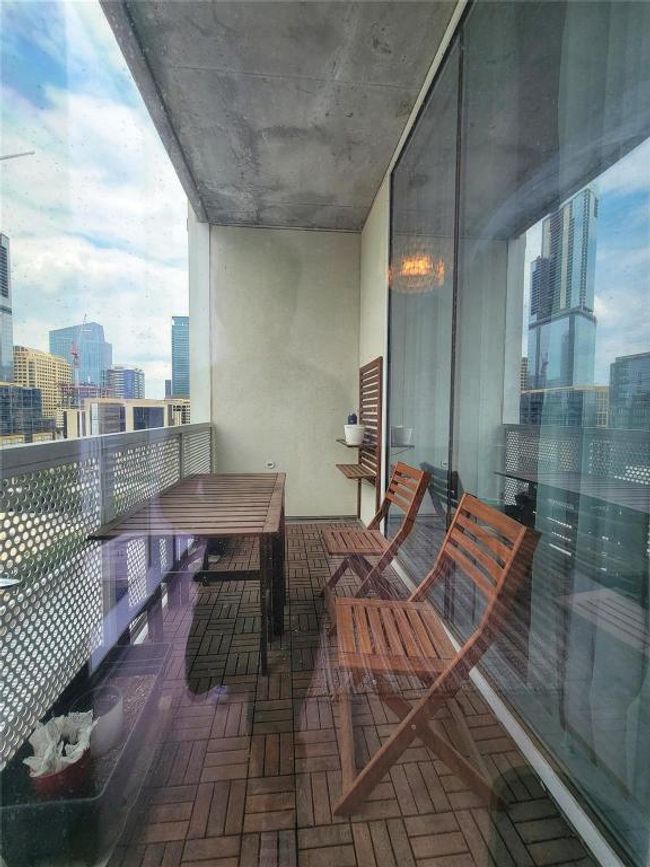 Balcony featuring a view of city | Image 9