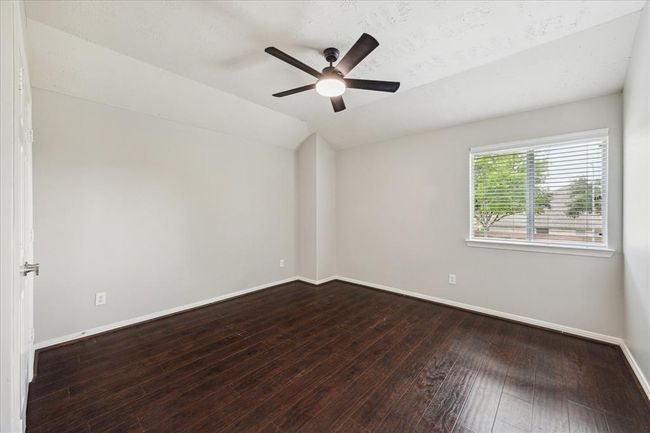 Third generously sized bedroom with new fan (2/24), beautiful engineered wood flooring, nice sized closet and window blinds. | Image 43