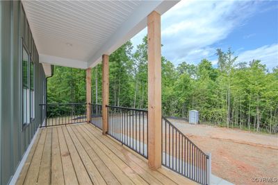 The front porch is covered and has outdoor lighting. Enjoy rocking on the porch in the evening and enjoy the view of nature. | Image 3