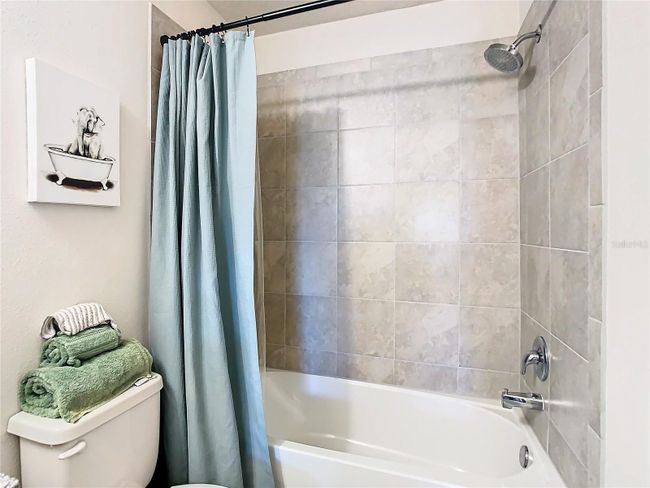 Upgraded tile in guest bathroom | Image 31