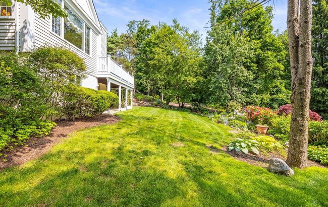 View of grassy yard featuring a balcony | Image 40