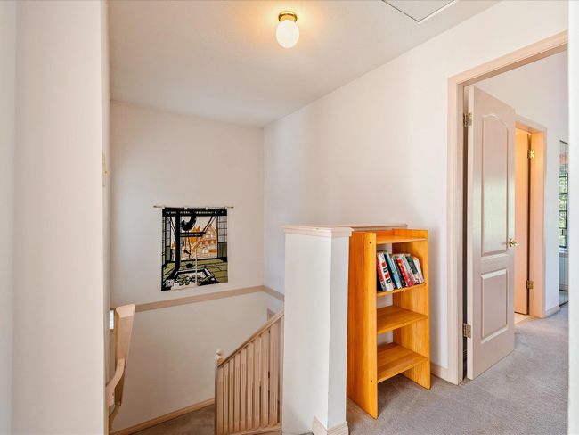Hallway featuring carpet and an upstairs landing | Image 23
