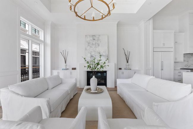 The gorgeous Heat & Glo 42" fireplace offers warmth and ambiance, flanked by custom built-ins and layered architectural trim. | Image 6