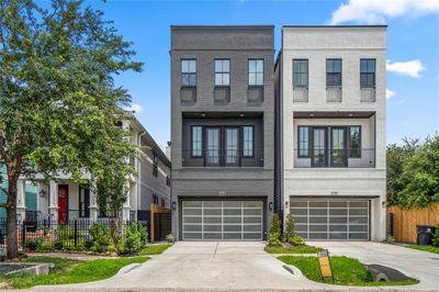 221 W 23rd Street is the dark grey house on the left. Stunning elevation and a long, private driveway to fit 4 cars. | Image 2