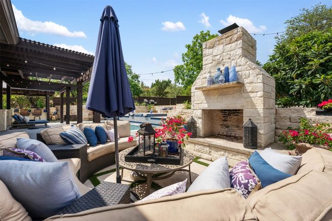 View of patio / terrace with an outdoor living space with a fireplace and a pergola | Image 29