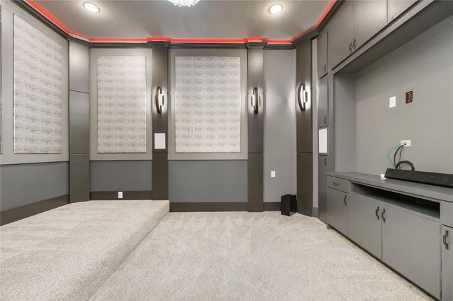 With custom, upgraded lighting and sound, enjoy the ultimate movie experience in this sound-proof movie theater. | Image 6