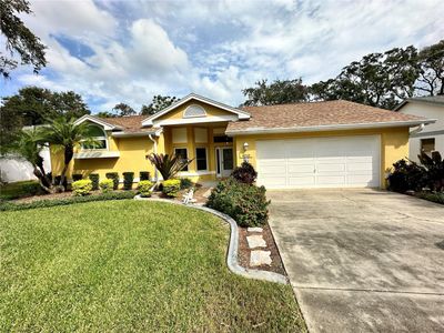 8215 Golf Club Court, House other with 3 bedrooms, 2 bathrooms and null parking in Hudson FL | Image 1