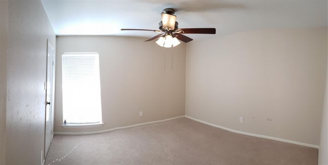 Bedroom #1 sits next to full batroom. It has ceiling fan for added cooling. Large walk-in closet. | Image 6