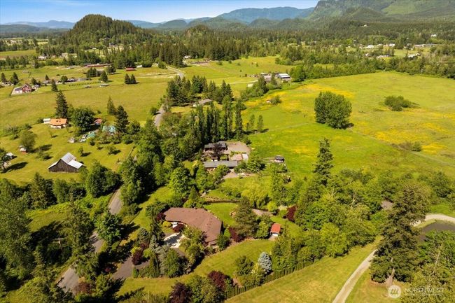 Outbuildings, barn, and greenhouse add space for animals, gardening, equestrian pursuits, or business ideas—imagine a wellness retreat, Airbnb, or wedding venue. | Image 27