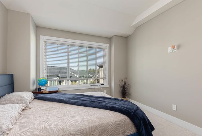 Carpeted bedroom with baseboards | Image 17