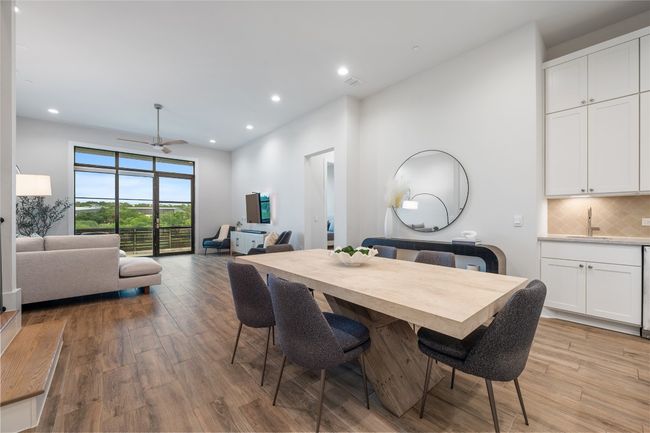 Open floor plan provides for a dining experience near kitchen boasting views of Shoal Creek Greenbelt. | Image 5