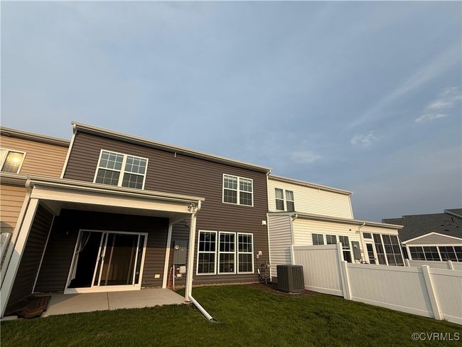 Rear view of house featuring cooling unit and a patio | Image 27