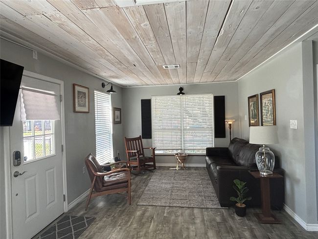 Living area featuring wood ceiling and hardwood / wood-style flooring | Image 8