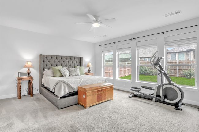 #1 Downstairs Bedroom featuring ceiling fan and carpet | Image 16