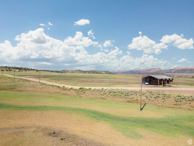 View of yard featuring a detached carport and a view of countryside | Image 10