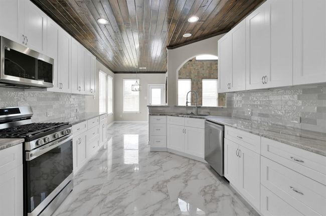 Kitchen and breakfast area straight with the back door. | Image 15