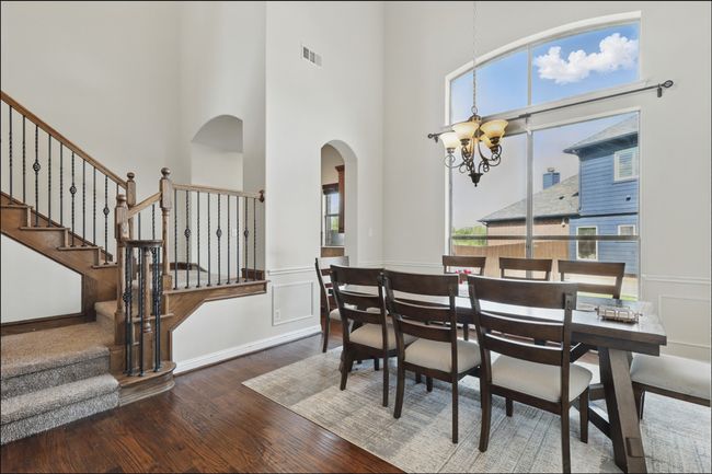 Office with plenty of natural light, wood finished floors, and french doors | Image 6