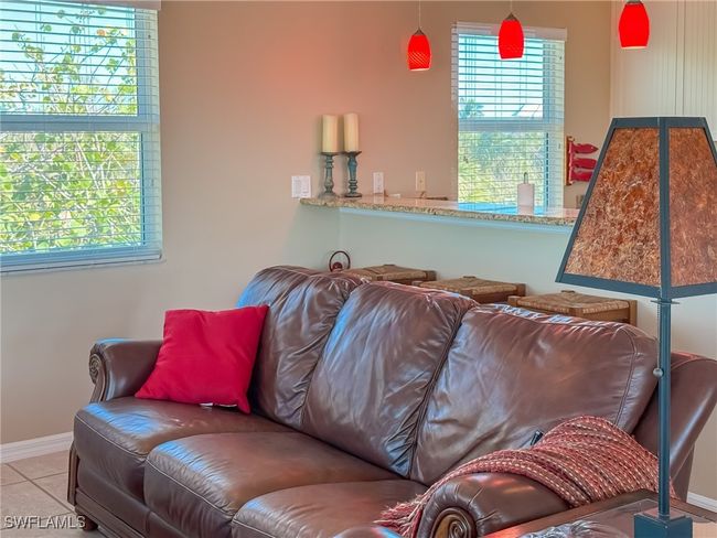 Living room with baseboards and tile patterned floors | Image 20