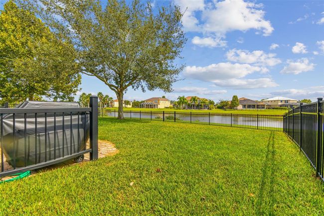 Large fenced backyard with gorgeous pond views! | Image 28