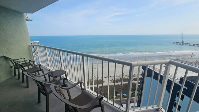Balcony with a water view and a view of the beach | Image 16
