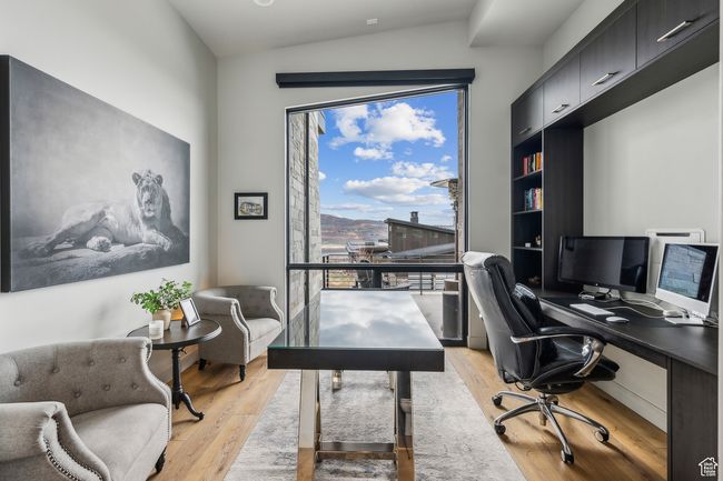 Office space featuring light wood-style floors | Image 31