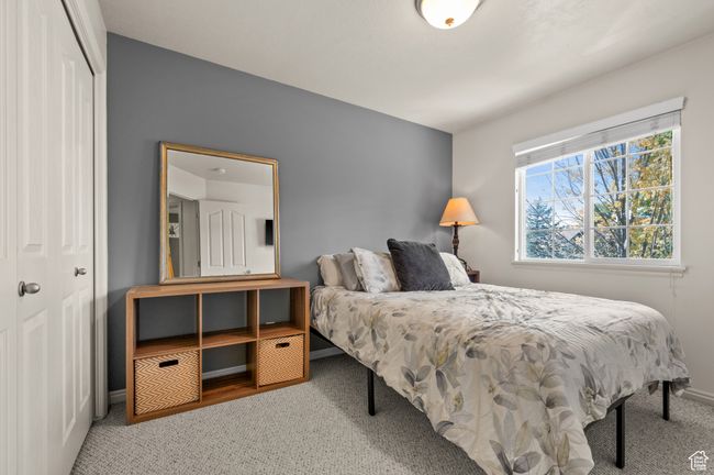 Carpeted bedroom with a closet and baseboards | Image 16