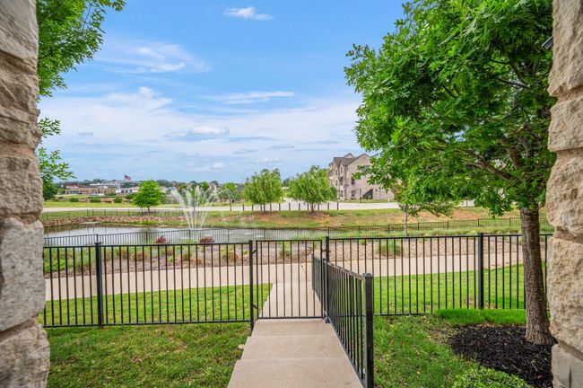 View of yard with a water view, fence, and a gate | Image 5