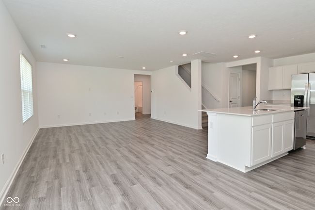 View of the family room from the dining area. | Image 21