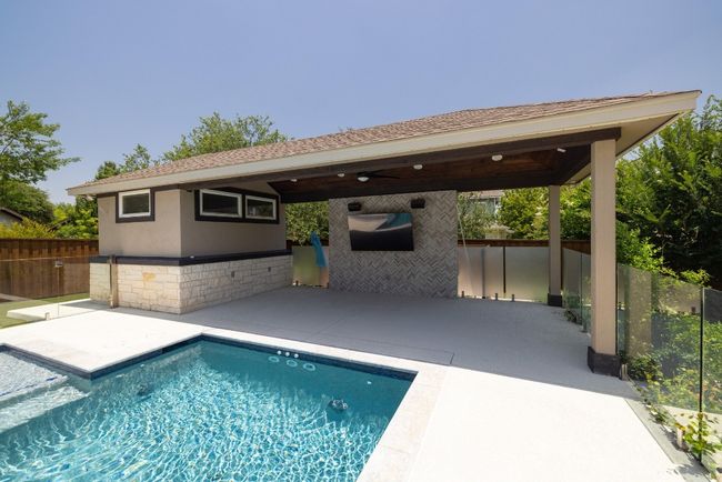 View of swimming pool featuring a patio, area for grilling, a gazebo, and a ceiling fan | Image 38