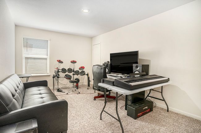 Carpeted bedroom featuring baseboards | Image 22