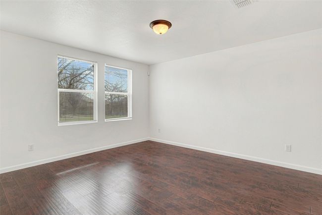 Empty room with dark wood finished floors and baseboards | Image 18