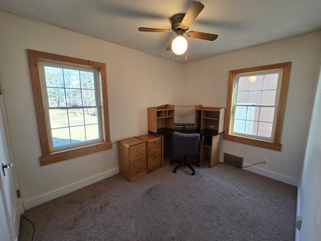 NE bedroom/office with ceiling fan | Image 20