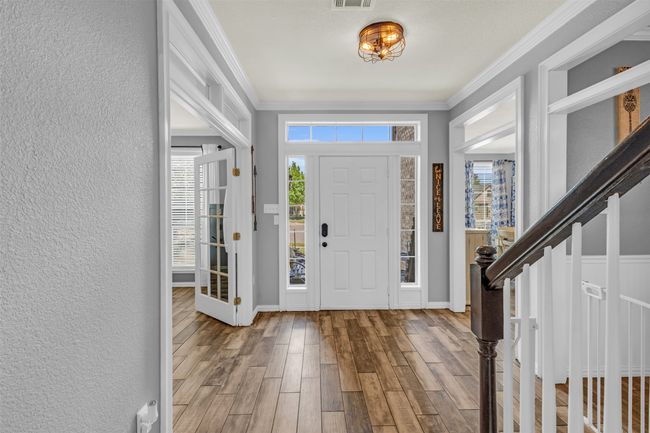 Entrance foyer featuring crown molding and hardwood / wood-style floors | Image 20