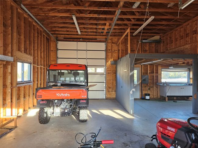 Vehicles in the RV garage show that there is plenty of room. There is also a side room off the main room | Image 41