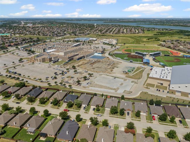 Aerial view of property and surrounding area featuring a large body of water and nearby suburban area | Image 36
