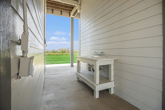 An additional outdoor sink offers practical convenience for your waterfront activities, from cleaning fish to rinsing beach gear. | Image 37